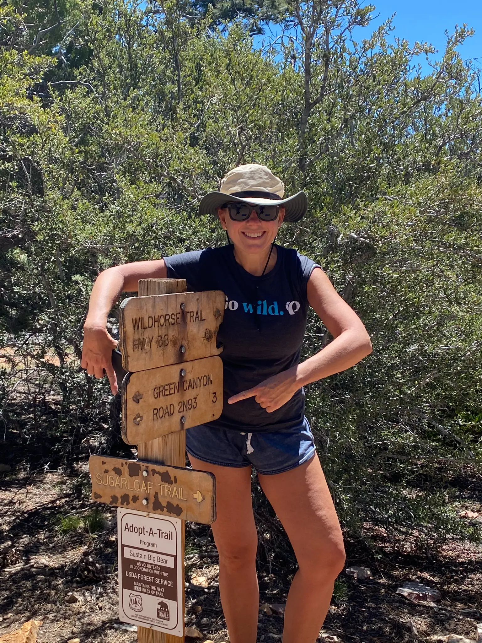 Kristen at the Wildhorse Trail / Sugarloaf Trail sign in Big Bear