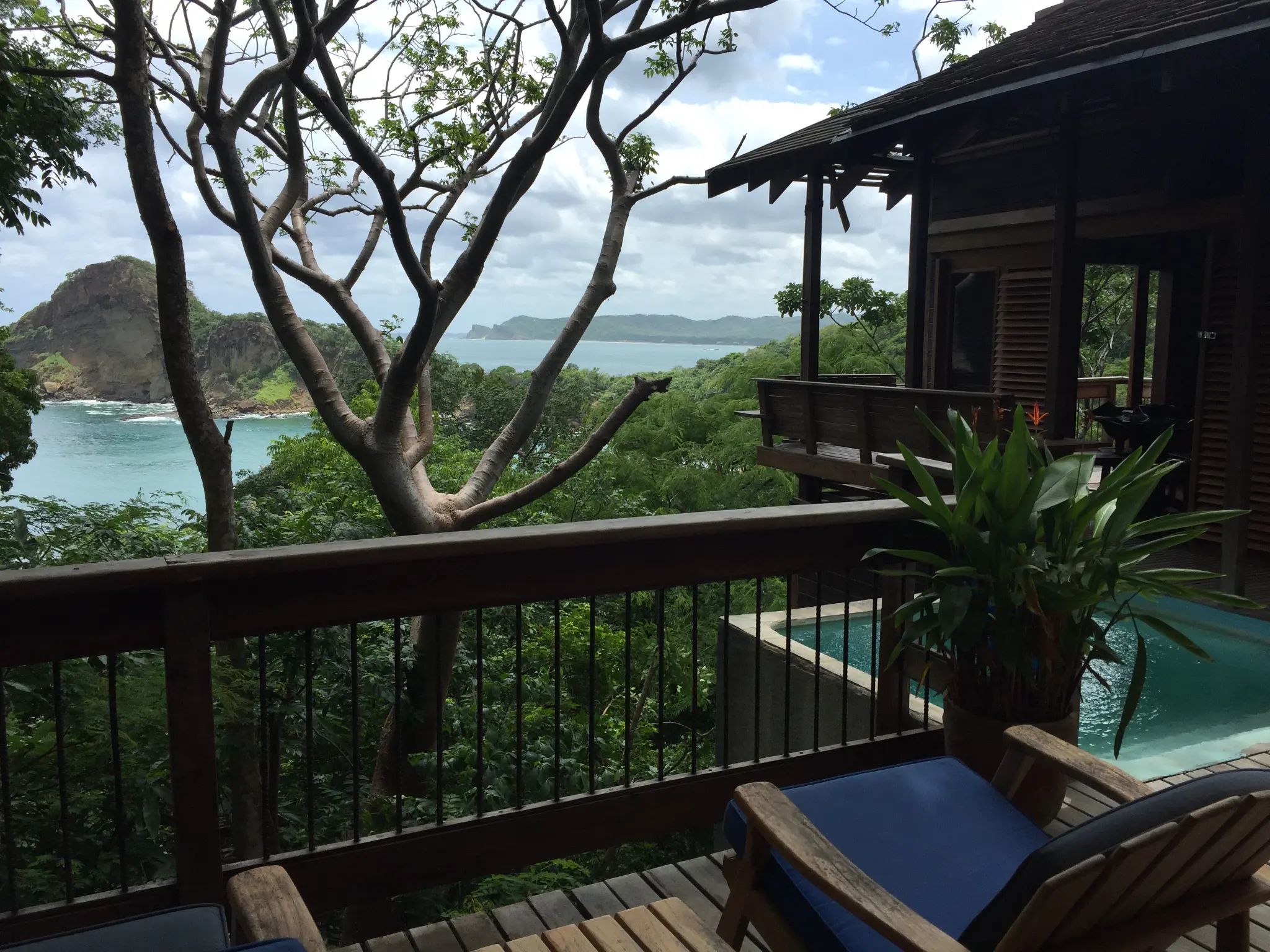 Treehouse villa deck at Aqua Resort Nicaragua — private infinity pool, jungle canopy, and Pacific ocean view