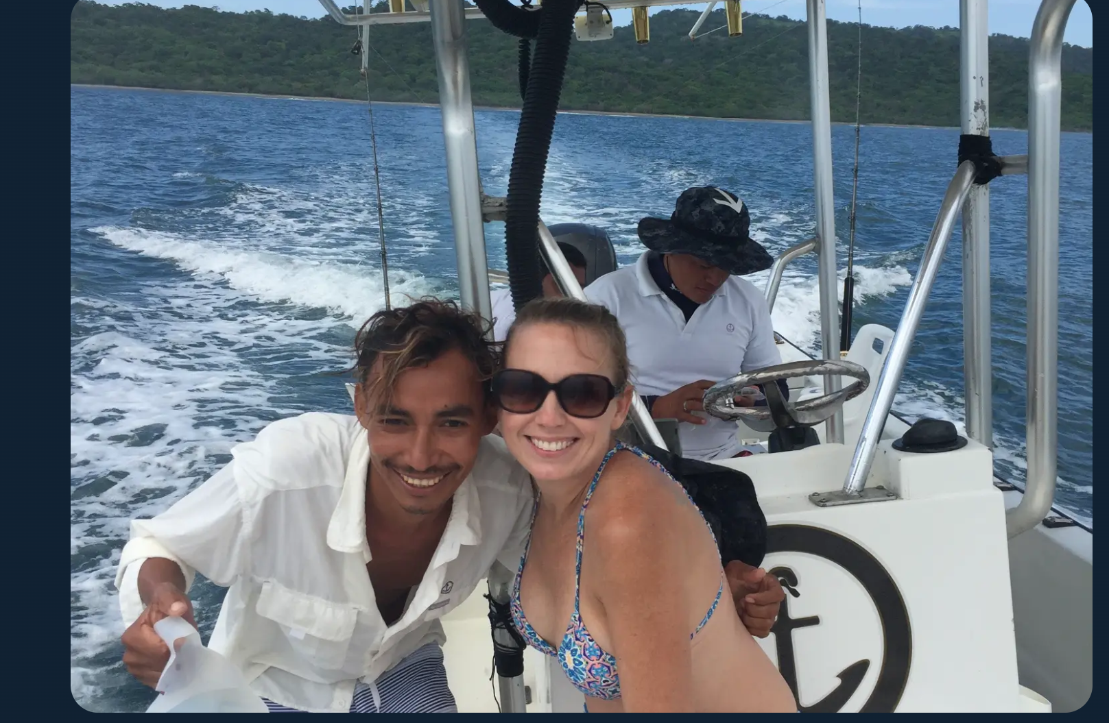 Smiling with a member of the boat crew on the Pacific waters off Nicaragua's Emerald Coast